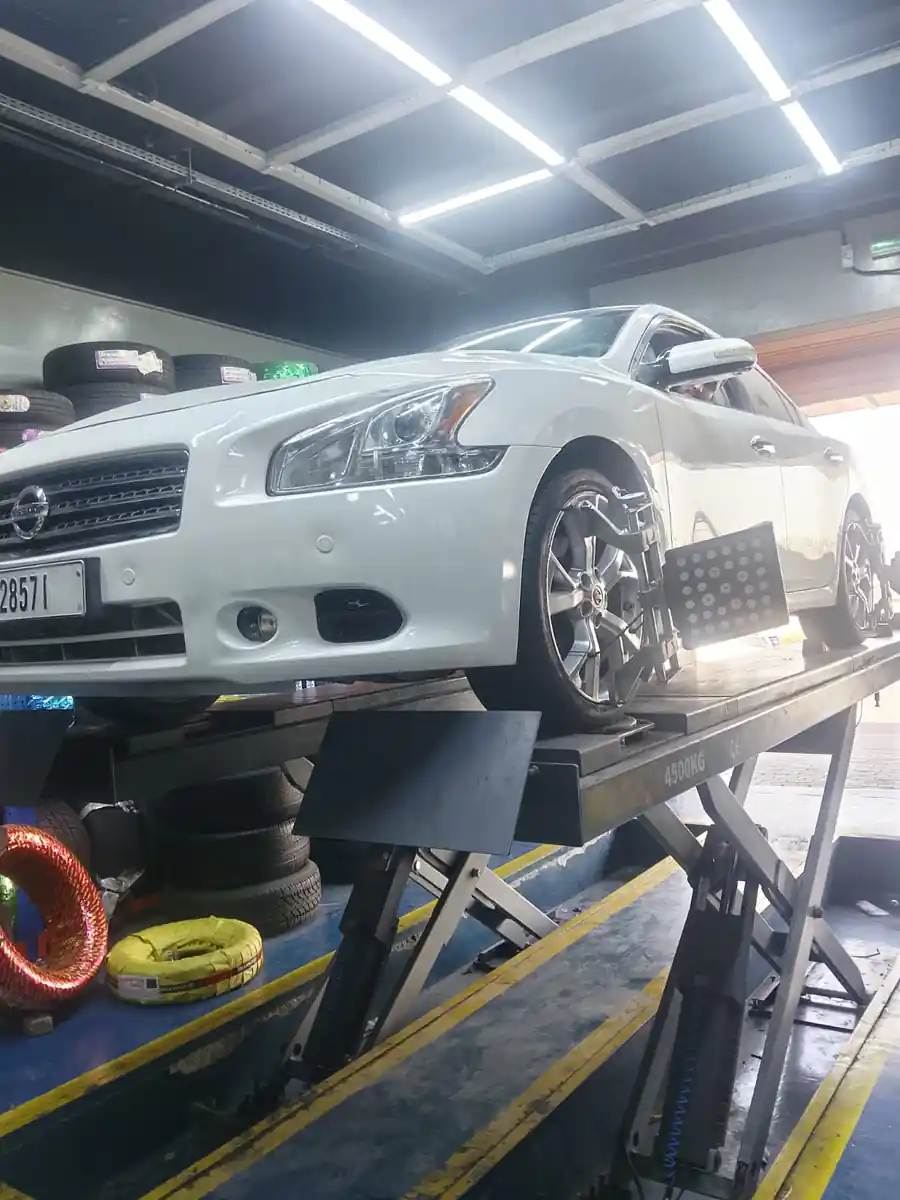 Technician replacing a car battery roadside